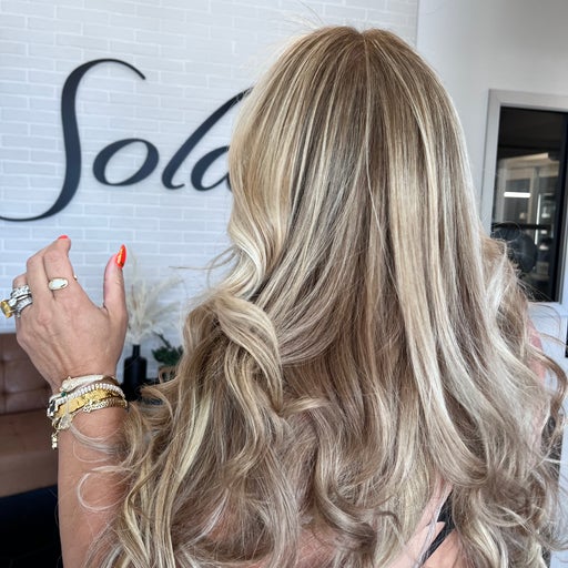 Glossy beige-blonde balayage finished at Adry's Salon & Spa